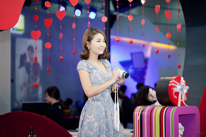 Woman Holding Camera — Blue, Festive