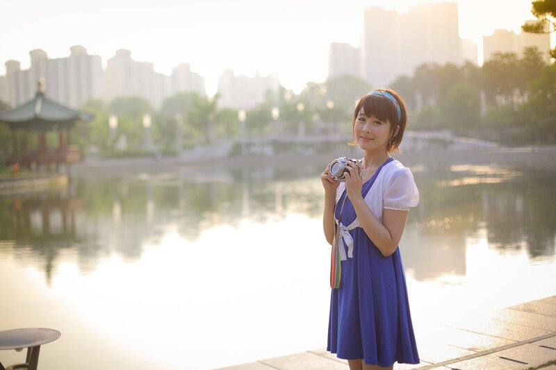 Woman Holding Camera — Blue, Serene, Sunset, Photograph, Lake, Pagoda
