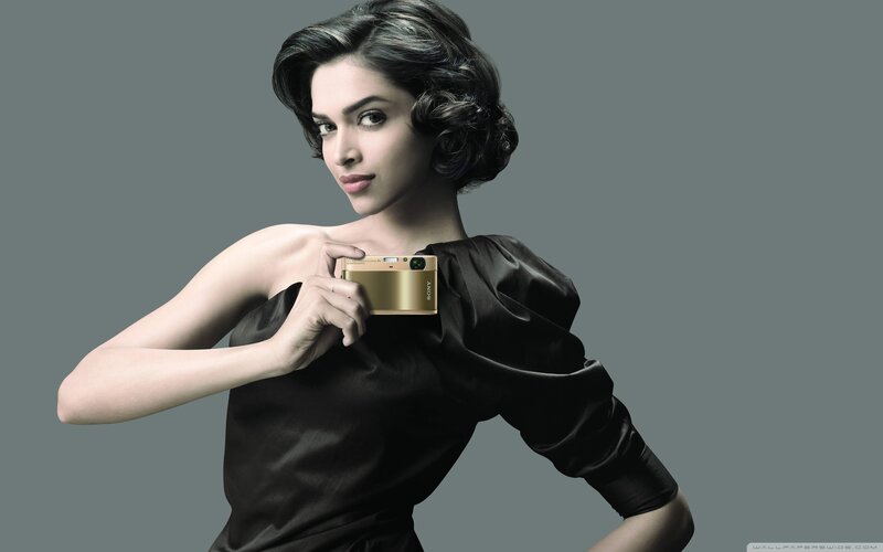 Woman Holding Camera — Gray, Dramatic, Photograph