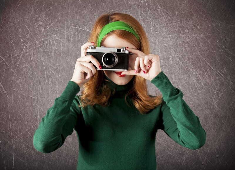 Woman Holding Camera — Green, Playful