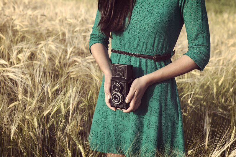 Woman Holding Camera — Green
