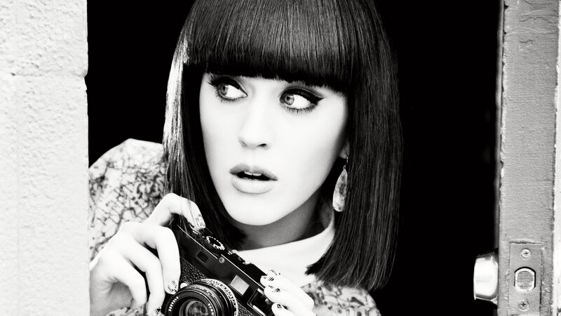woman holding camera in doorway