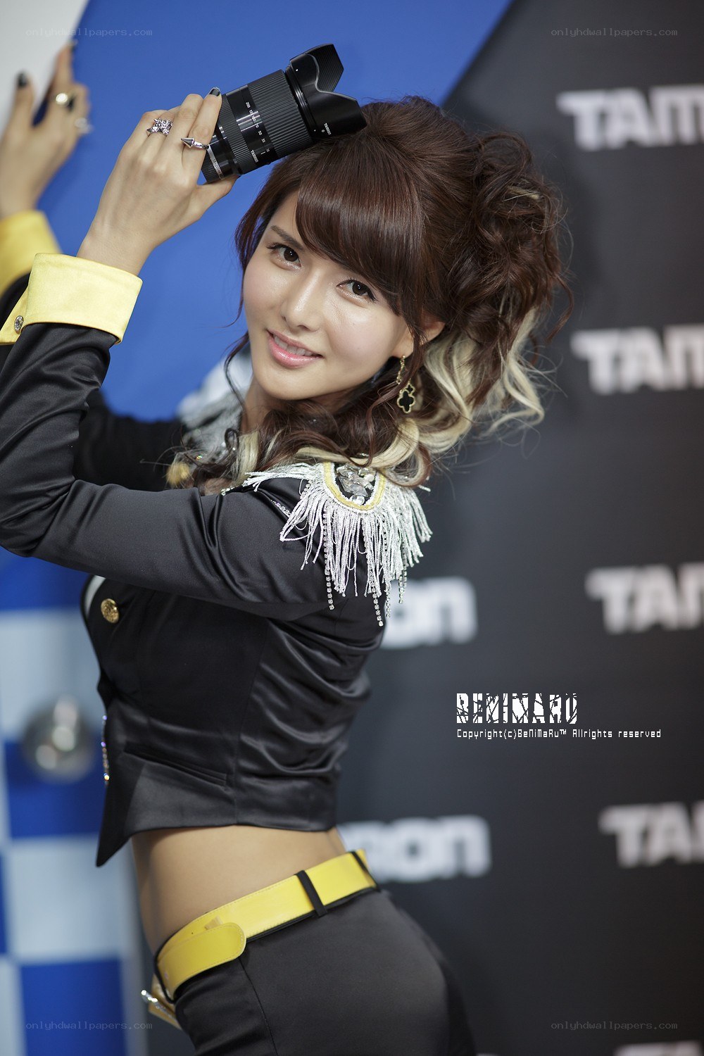 Woman holding camera lens