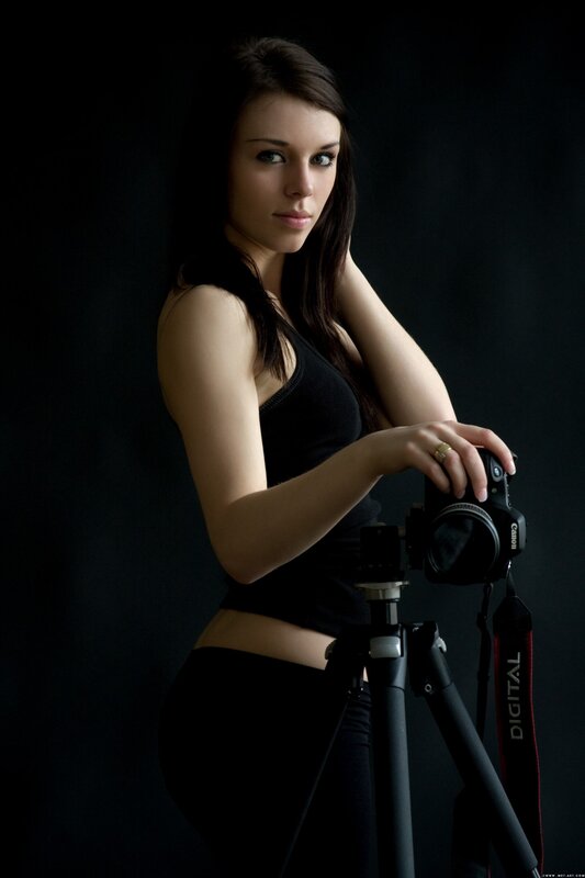 Woman Holding Camera — Photograph