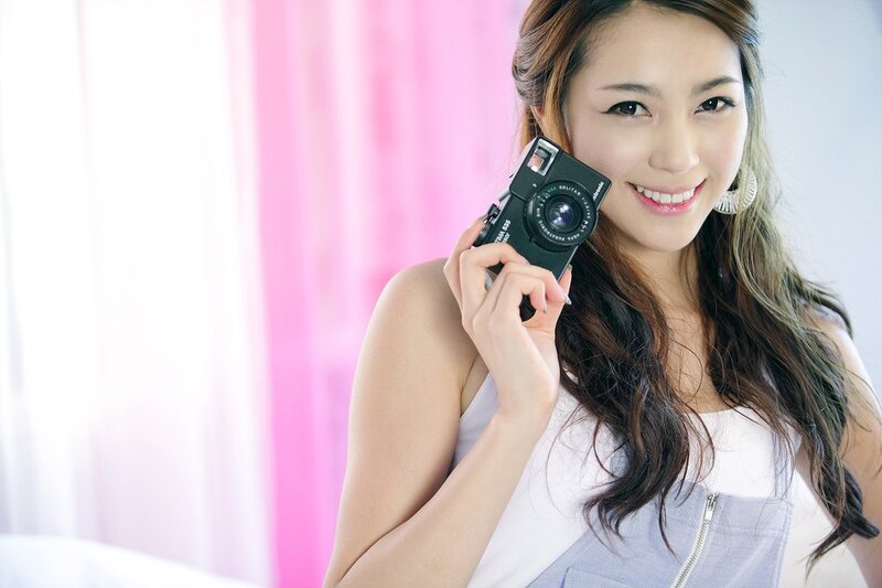 Woman Holding Camera — Pink, Cheerful