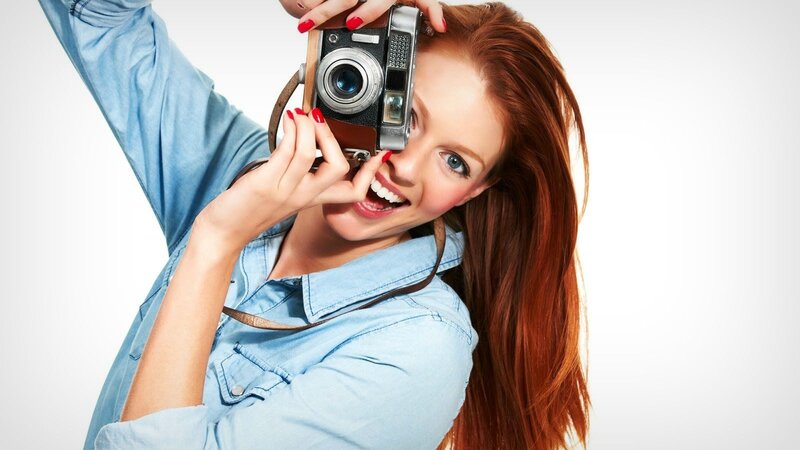 Woman Holding Camera — Red, Happy