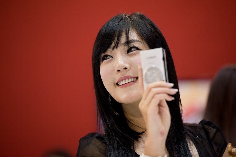 Woman Holding Camera — Red, Neutral, Photograph, Black Hair