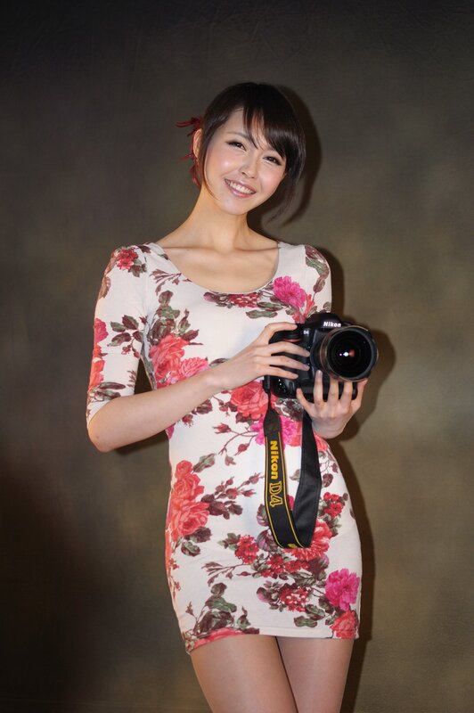 Woman Holding Camera — White, Friendly, Photograph