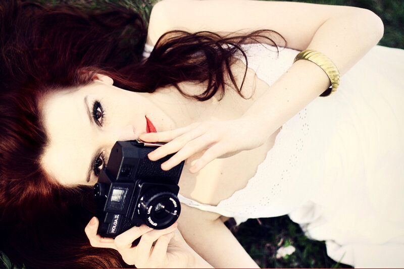 Woman Holding Camera — White