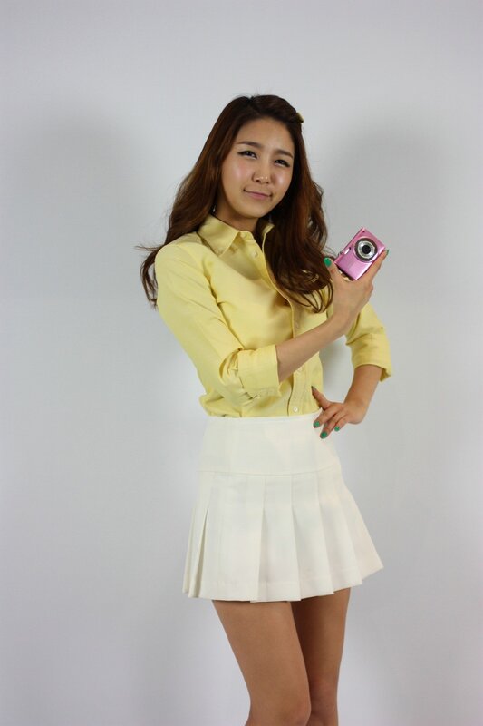 Woman Holding Camera — Yellow, Neutral