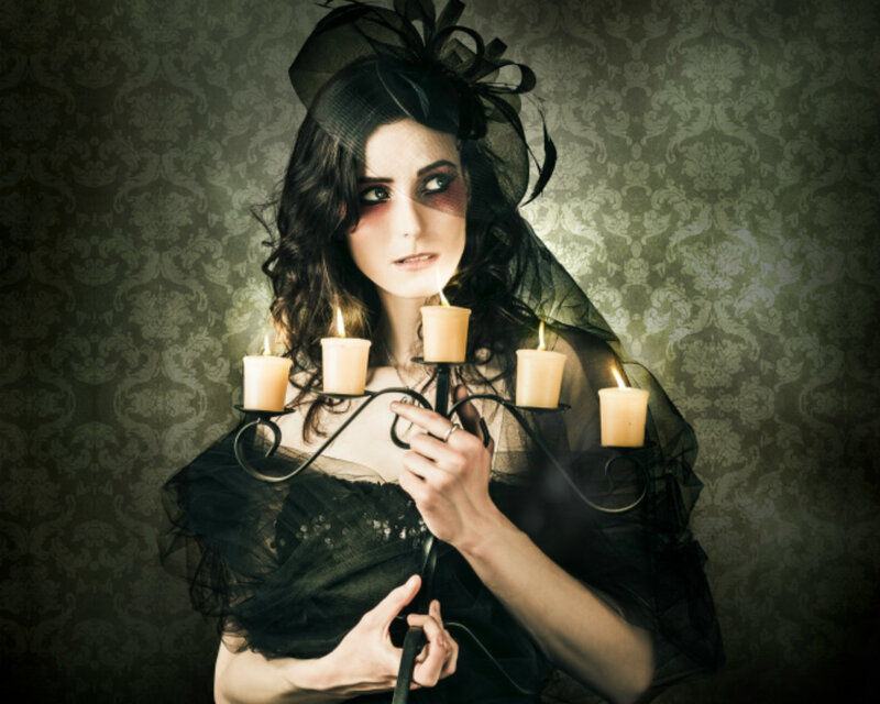 Woman Holding Candle Holder
