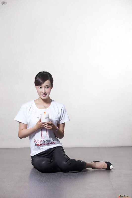 woman holding candle in studio
