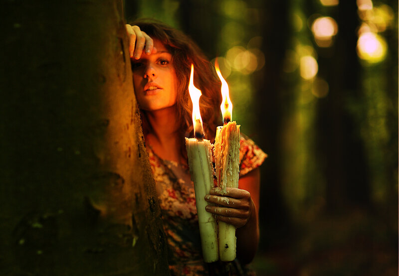 Woman Holding Candles