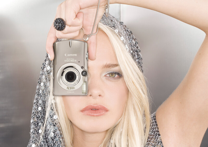 Woman holding Canon camera