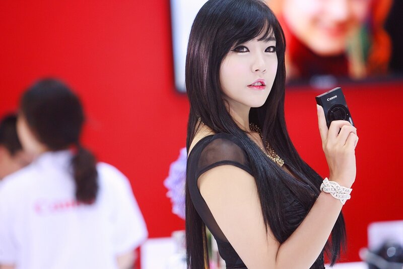 Woman holding Canon camera
