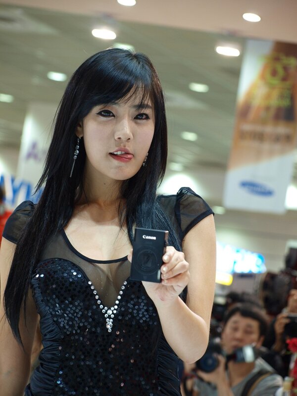 Woman holding Canon camera