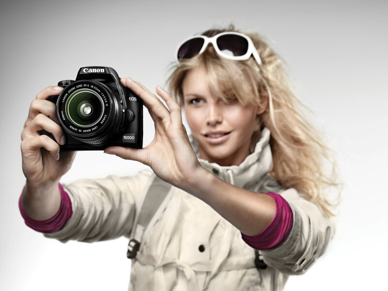 Woman holding Canon camera