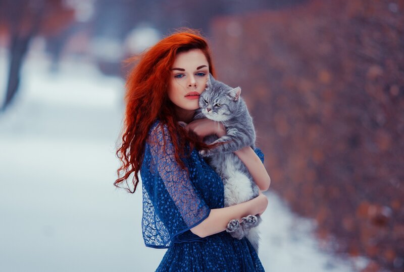 Woman Holding Cat — Blue, Serene, Winter