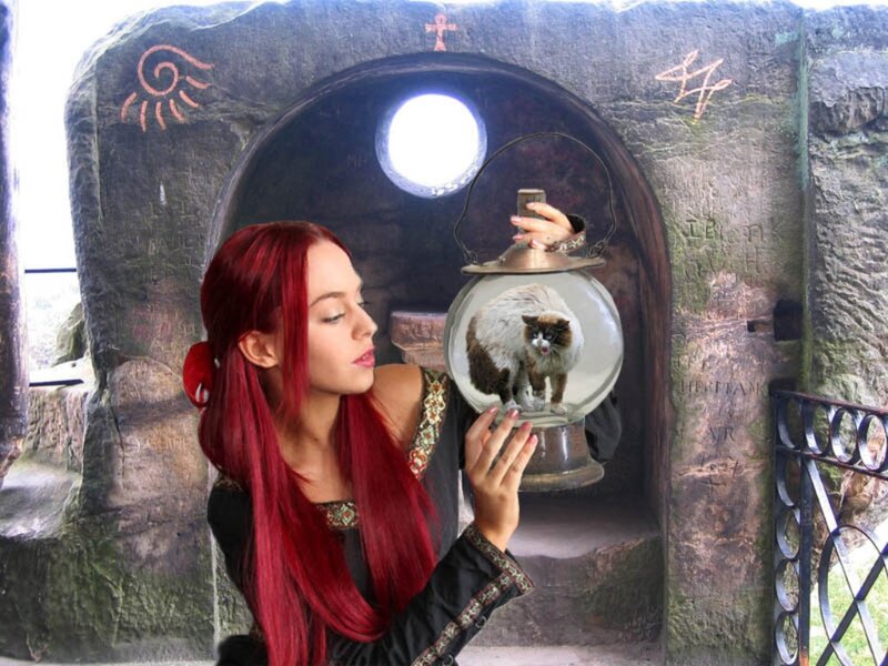 Woman Holding Cat in Sphere
