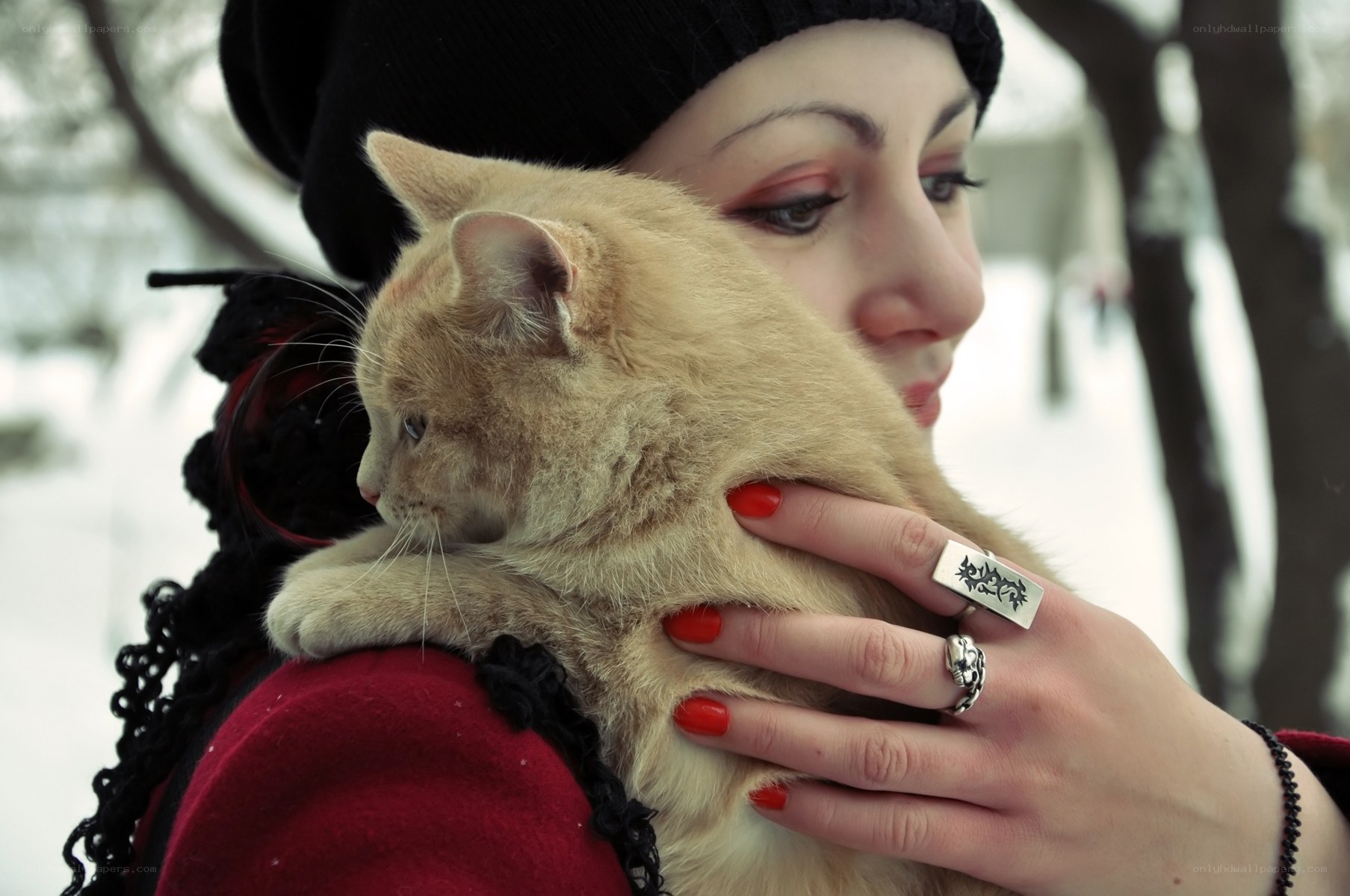 woman holding cat in winter