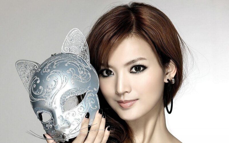 woman holding cat mask