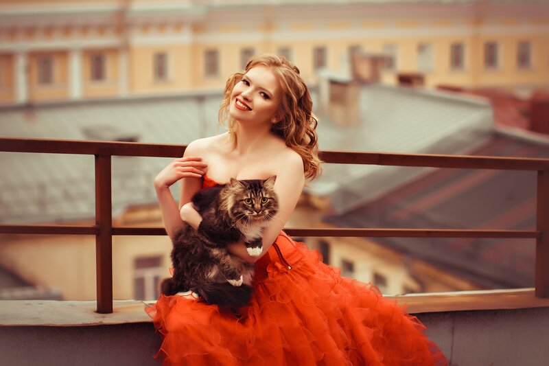 Woman Holding Cat — Red, Calm, Afternoon