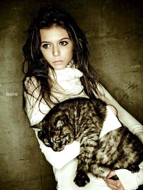 Woman Holding Cat — White, Dramatic
