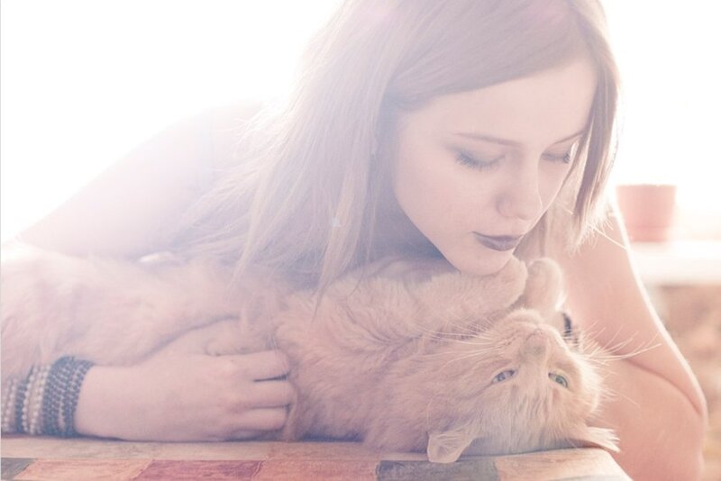 Woman Holding Cat — White, Serene
