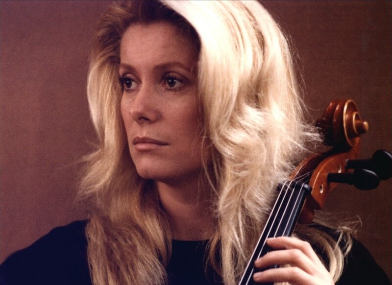 Woman Holding Cello