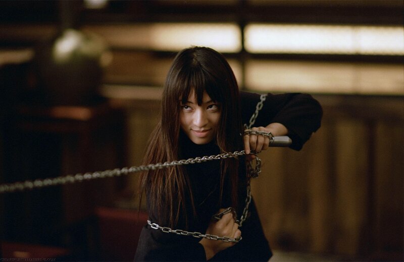 woman holding chain weapon