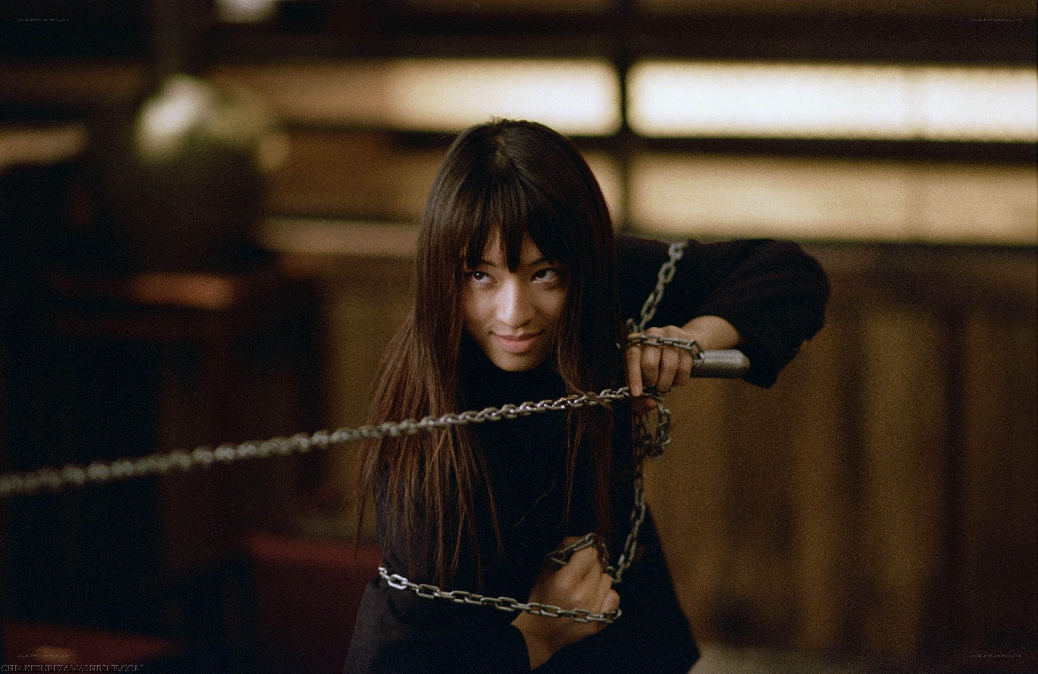 woman holding chain weapon
