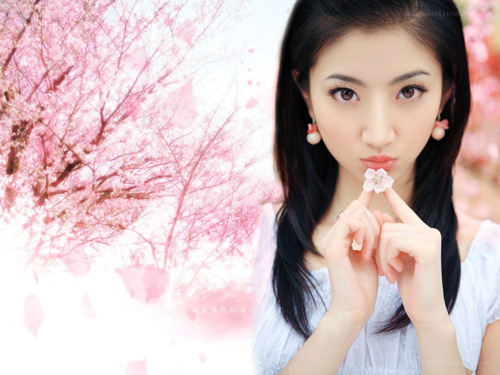 woman holding cherry blossom