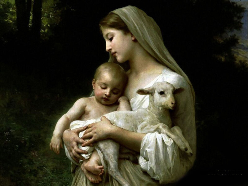 Woman holding child and lamb