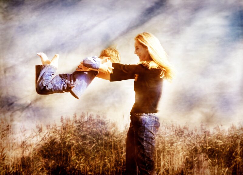 Woman Holding Child — Blue, Joyful
