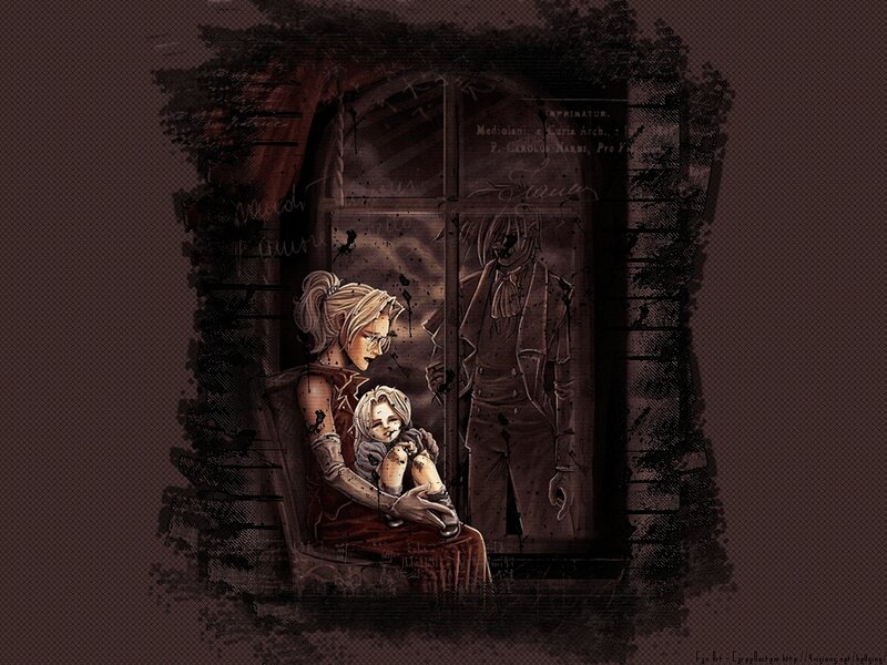 woman holding child in dark room