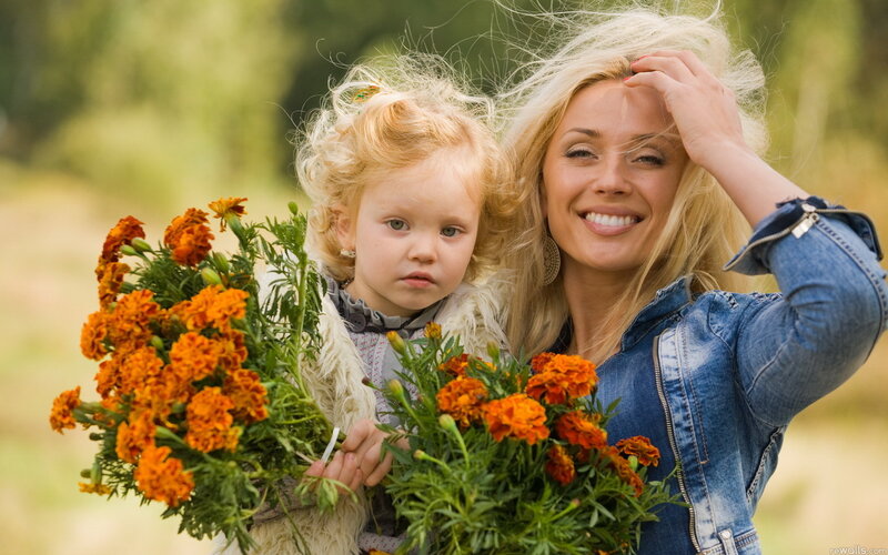 Woman Holding Child — Orange