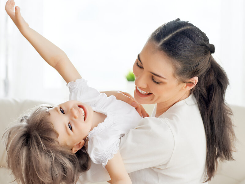 Woman Holding Child — White, Happy