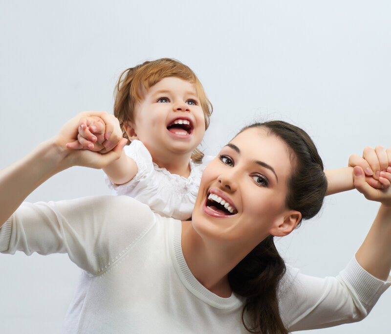 Woman Holding Child — White, Joyful