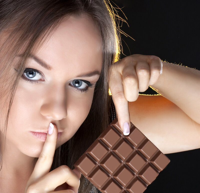 Woman Holding Chocolate Bar — Brown