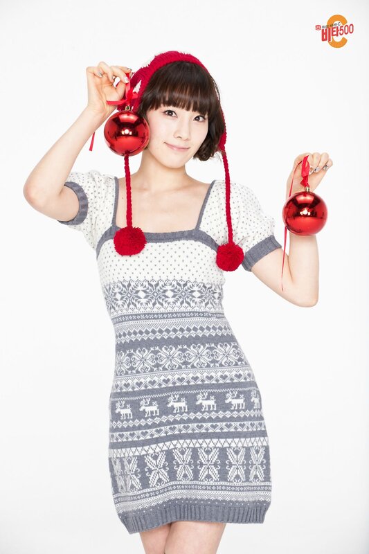 woman holding christmas ornaments
