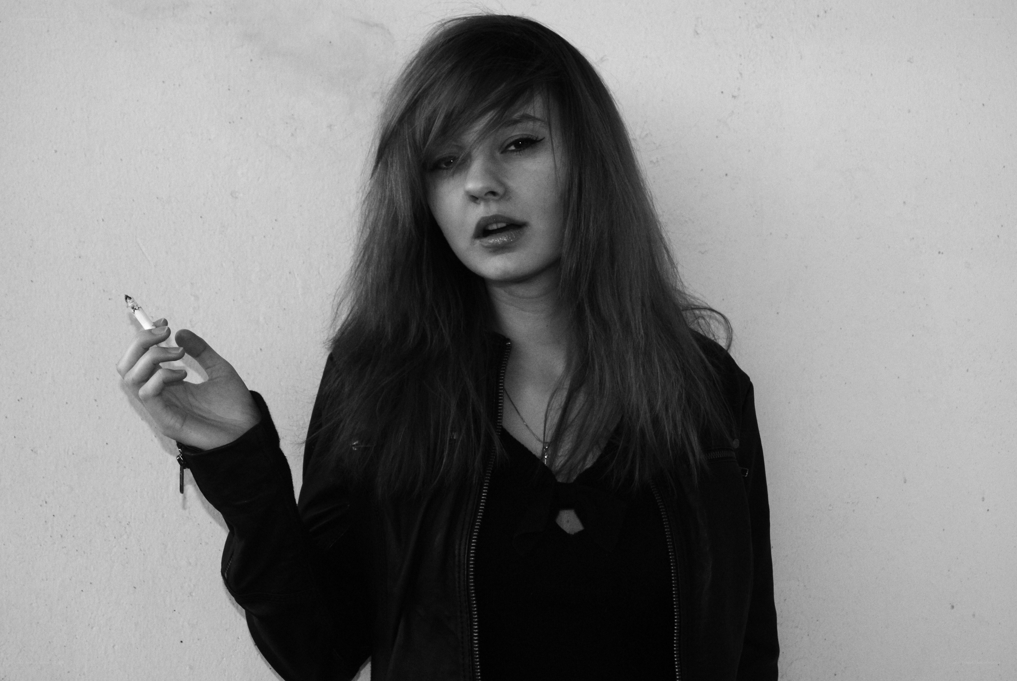 woman holding cigarette