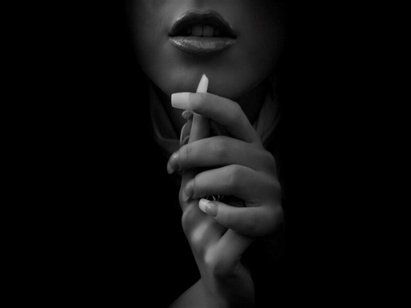 Woman Holding Cigarette — Black, Dramatic, Photograph, Hand