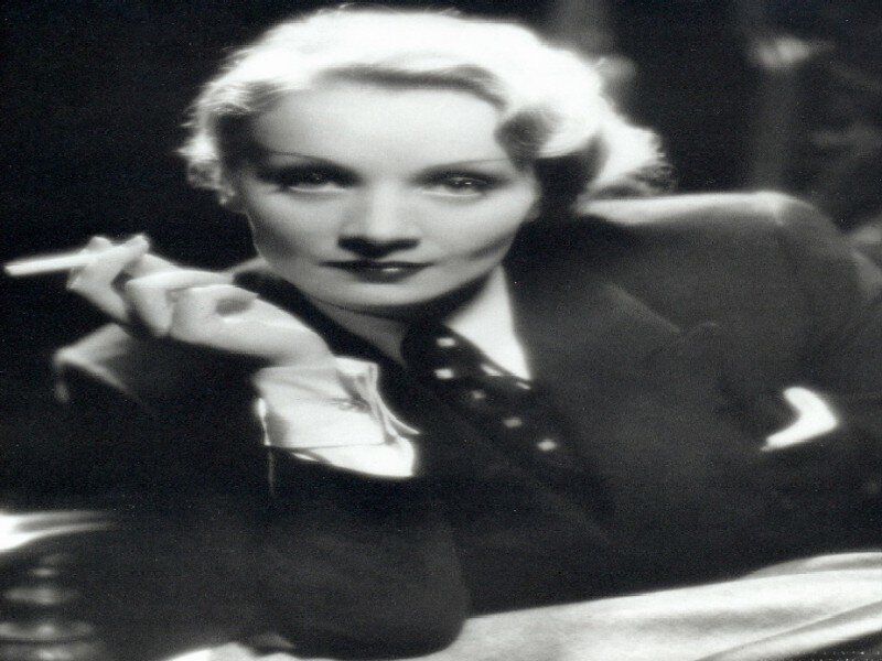 Woman Holding Cigarette — Black, Dramatic, Photograph, Suit