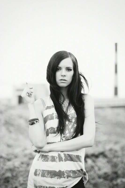 woman holding cigarette outdoors
