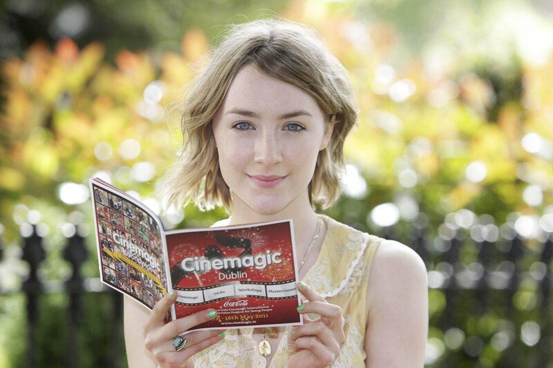 Woman holding Cinemagic brochure