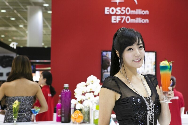 Woman holding cocktail at event