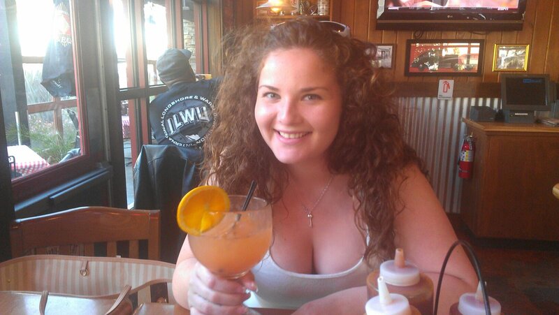 Woman Holding Cocktail — Brown
