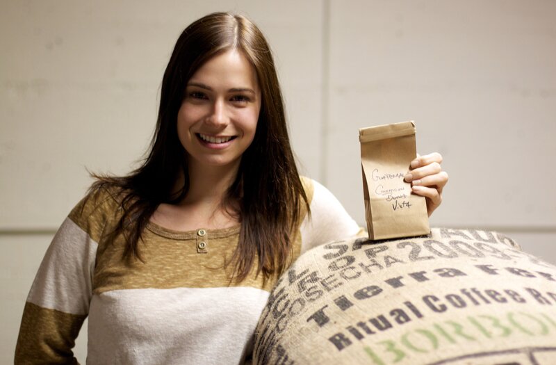 woman holding coffee bag