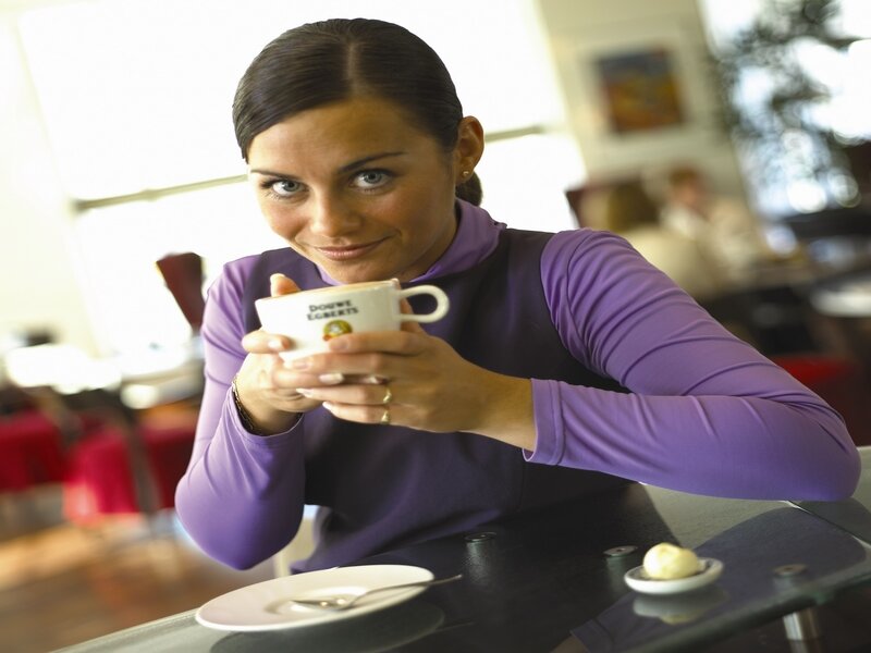 woman holding coffee cup