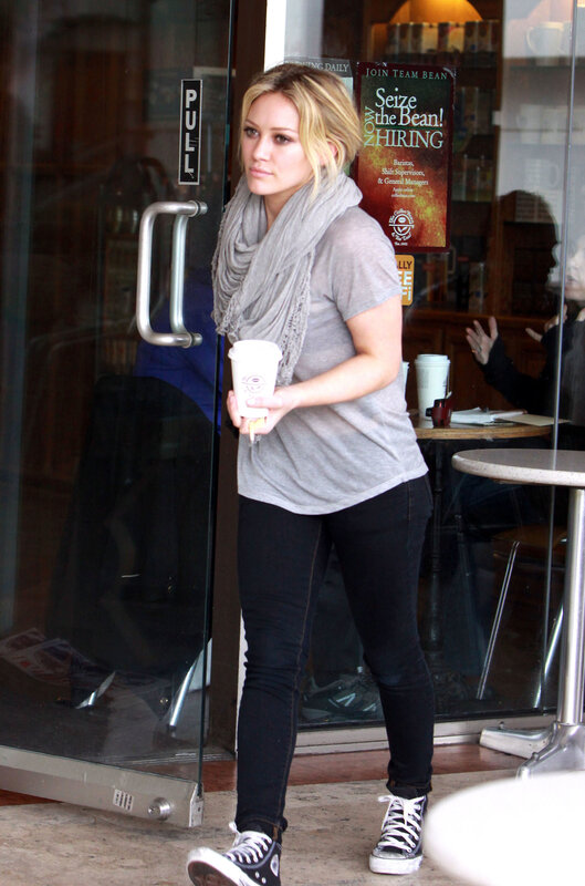 woman holding coffee cup